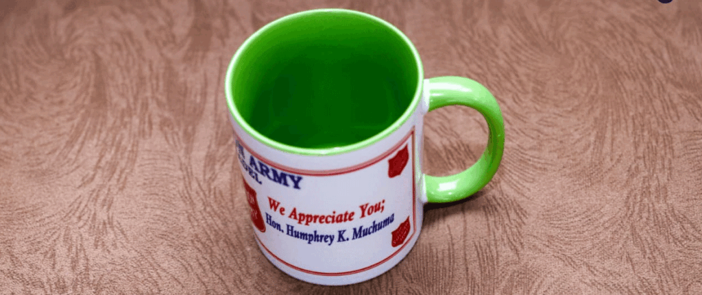 Humphrey-Muchuma-gifted-mugs-at-Salvation-Army-Church-Webuye