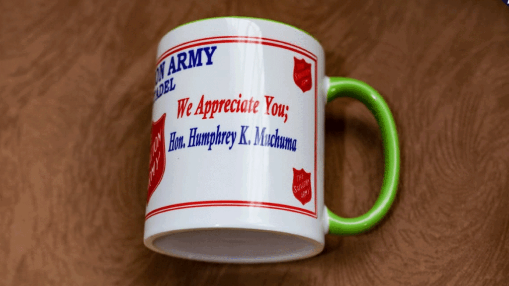 Humphrey-Muchuma-gifted-mugs-at-Salvation-Army-Church-Webuye