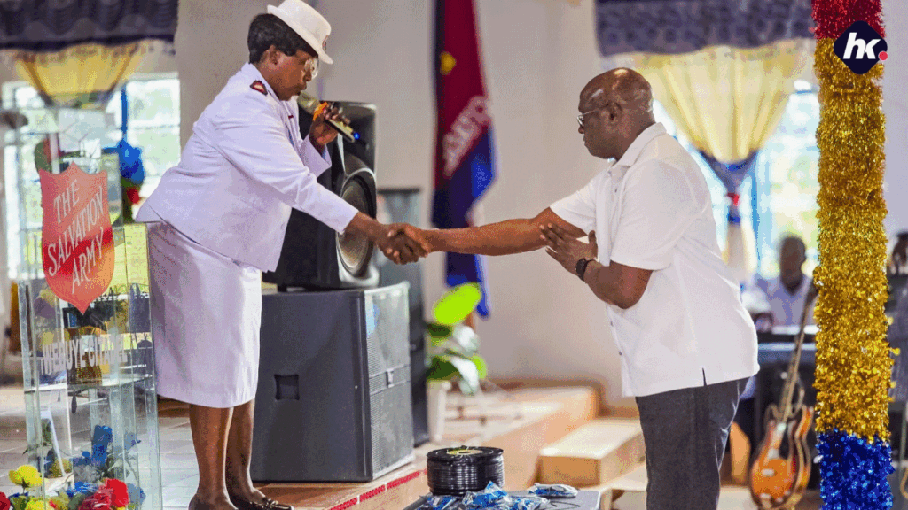 Humphrey-Muchuma-greets a sergent at The Salvation Army Webuye, Matulo Ward